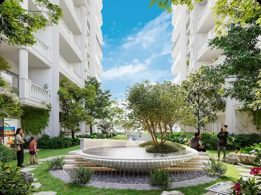 Garden courtyard with circular fountain between buildings