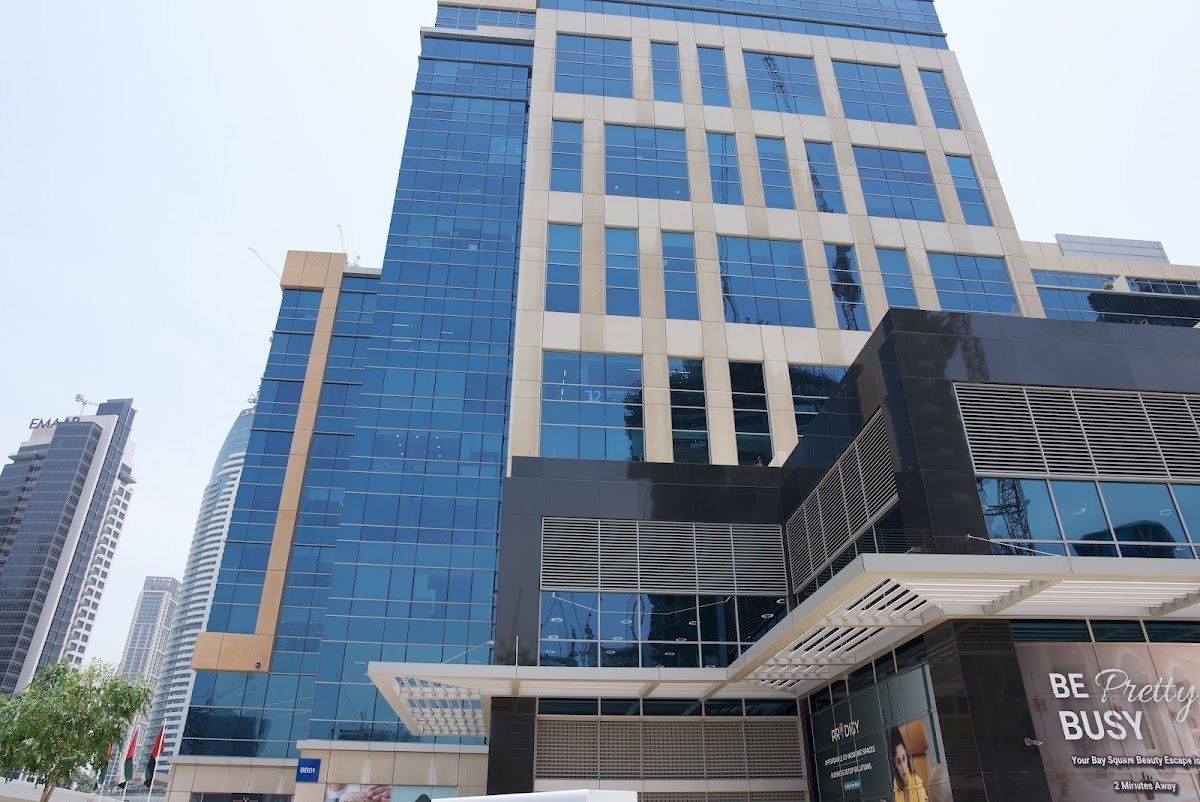 Glass and stone tower facade seen from street