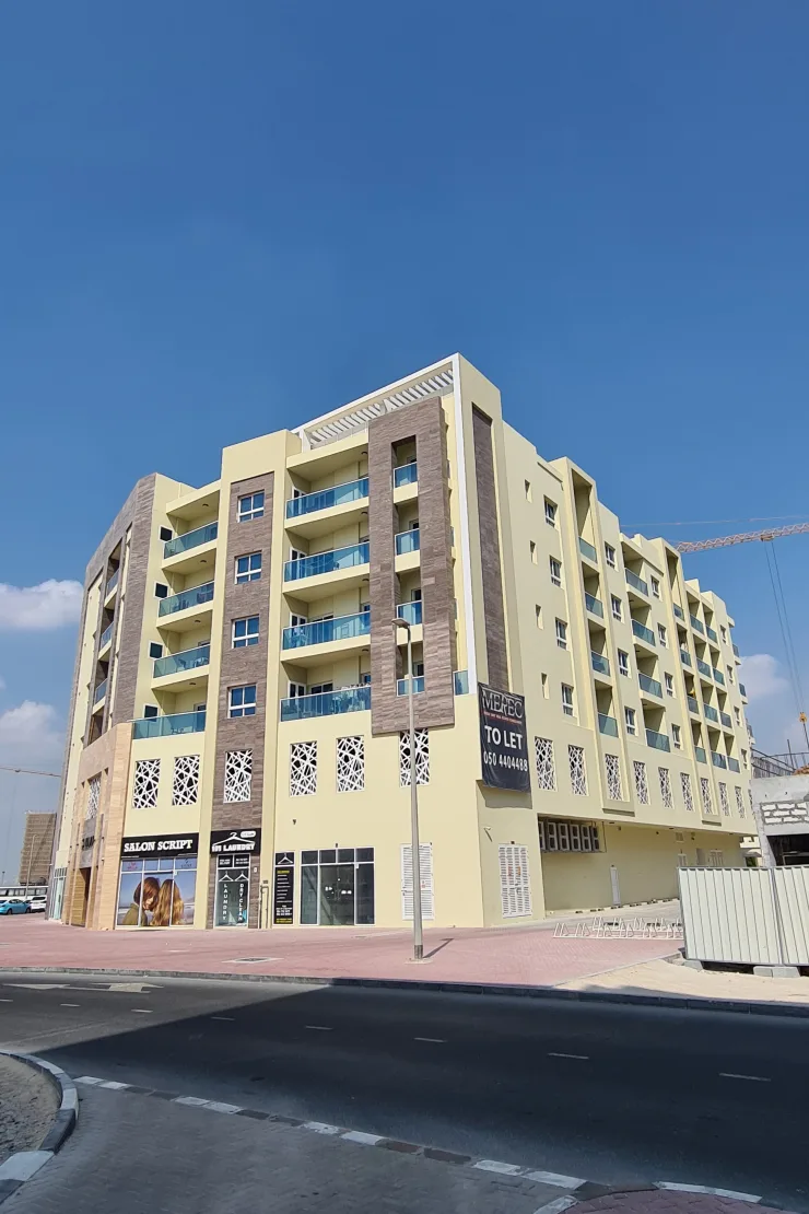 outside full height, corner view with the shops
