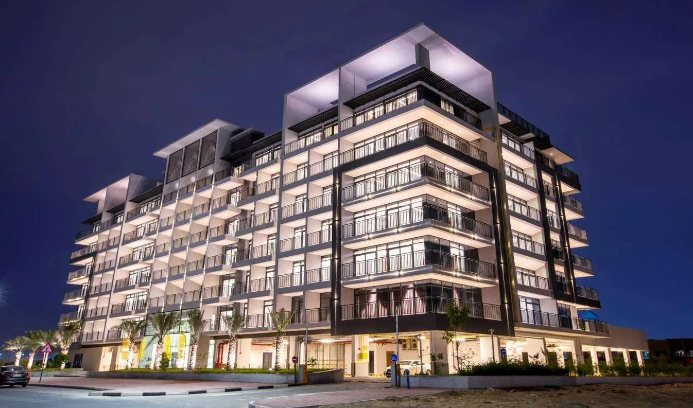 outside, full building at night (looks like a real photograph)