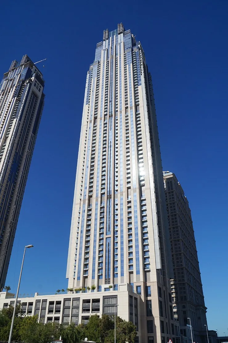 Full-height tower, beige and blue glass facade