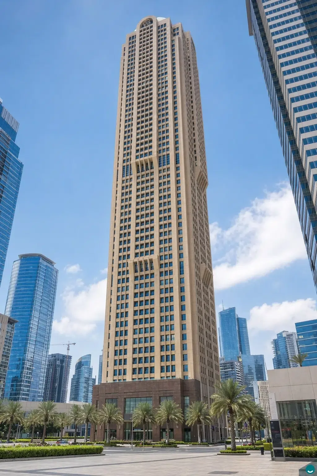 Tan tower seen from the plaza, base to top