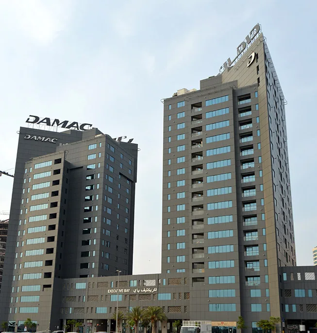 Both Executive Bay towers and podium from street