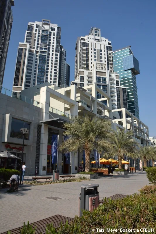 Tower rising above Bay Avenue podium and promenade