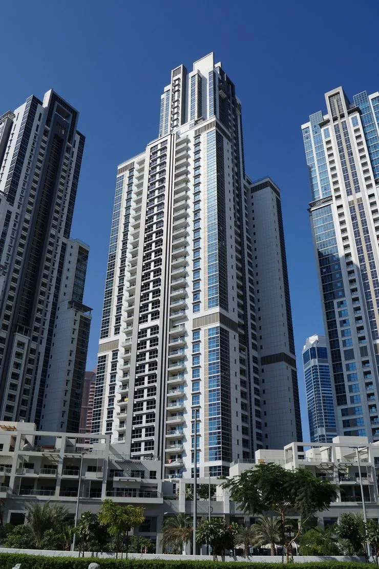 Full-height tower with stepped crown, seen from street level
