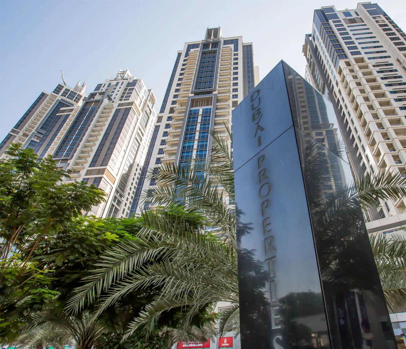 Executive Towers complex: outside, towers looking up past the Dubai Properties sign
