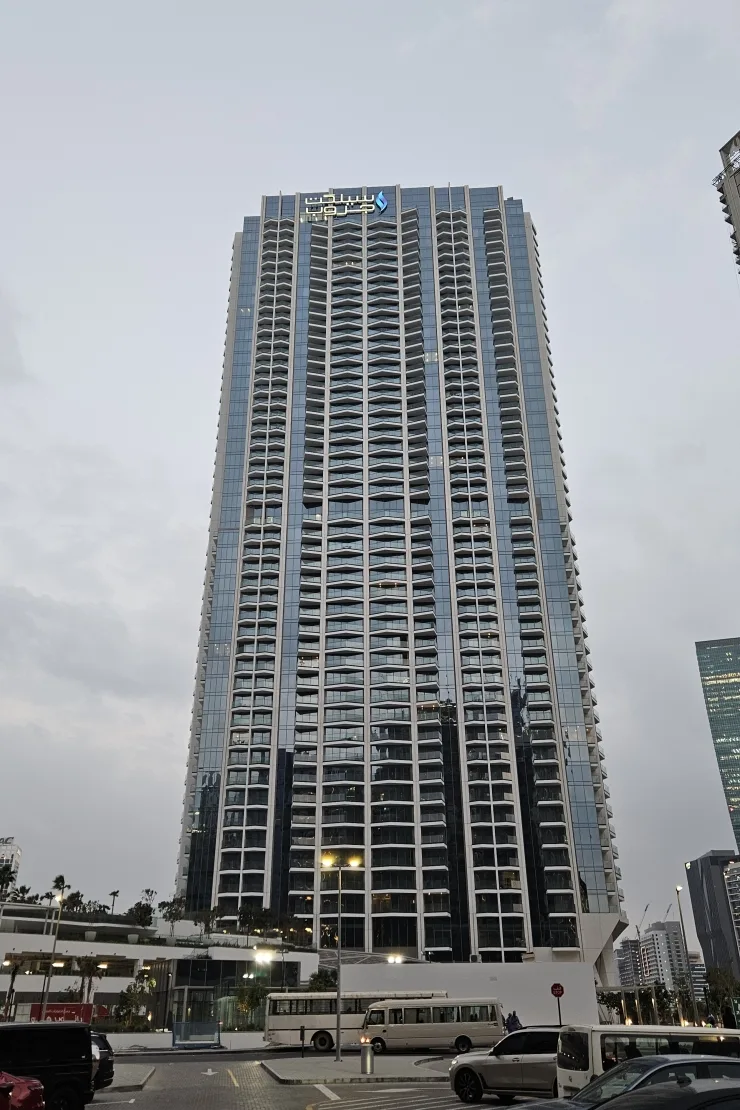 Tower facade with signage at the crown