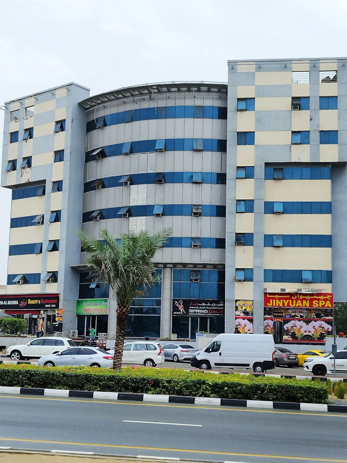 Front view of curved tower and wings