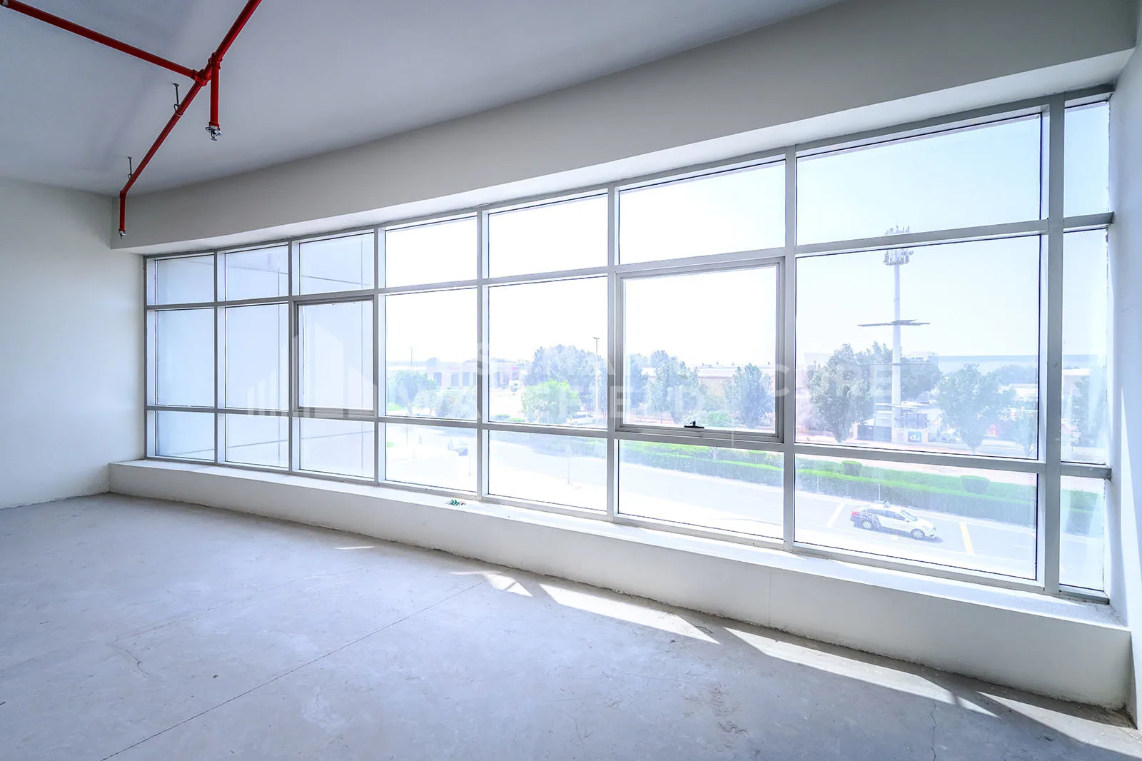 Office unit with large windows overlooking the street