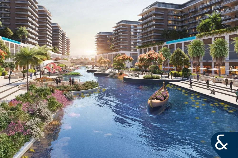 Waterfront promenade and canal with DAMAC building
