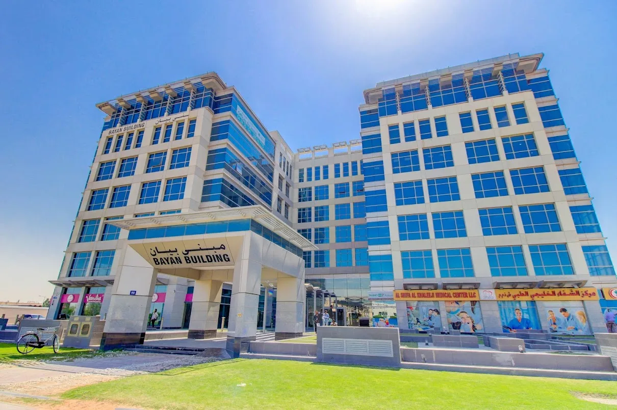 Bayan Building full facade with signed entrance canopy
