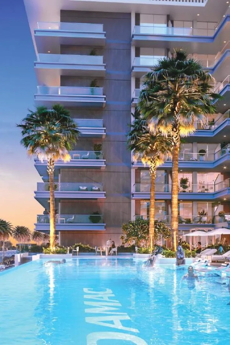 Podium pool with palms below stepped balconies