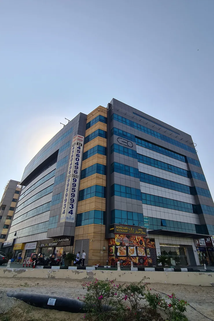 CEO Building from low angle, blue glazing, tan cladding