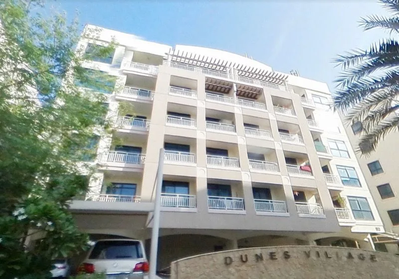 Dunes Village building with entrance sign, number 83