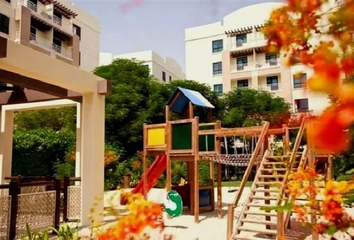 Children's playground with Dunes Village buildings behind