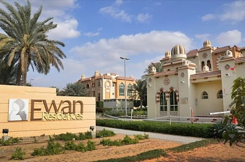 Ewan Residences entrance sign with domed buildings