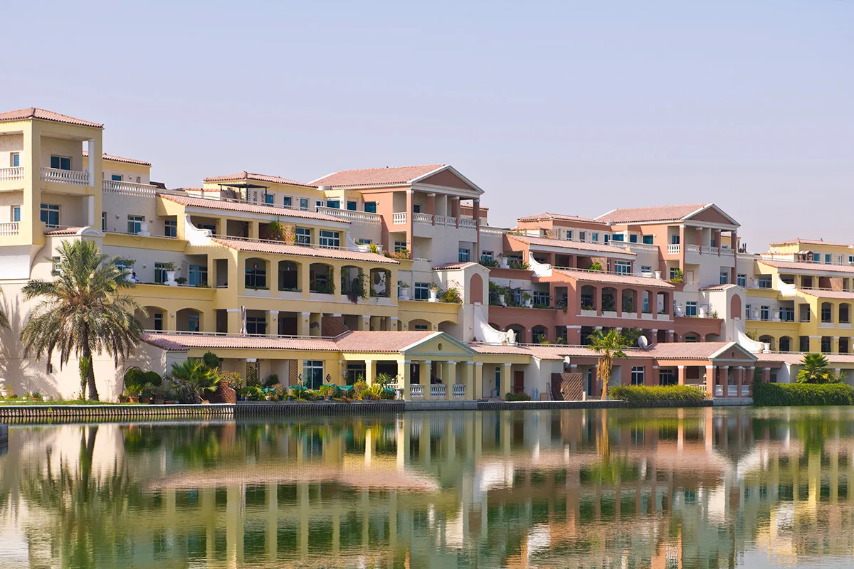 Lakeside apartment blocks with terracotta roofs