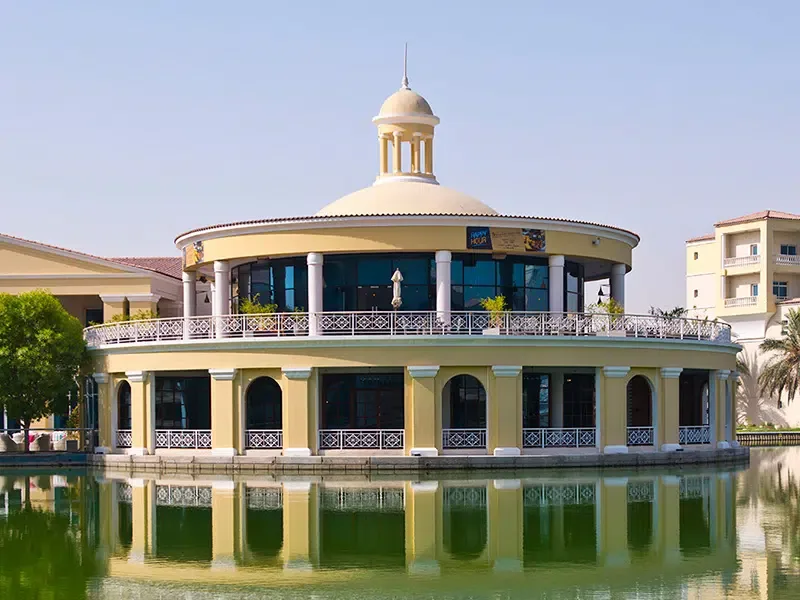 Round lakeside clubhouse with domed cupola