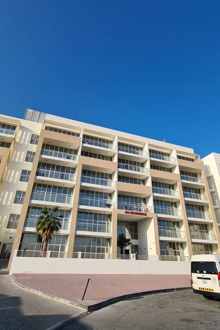 KH Residence front facade with signage, full height