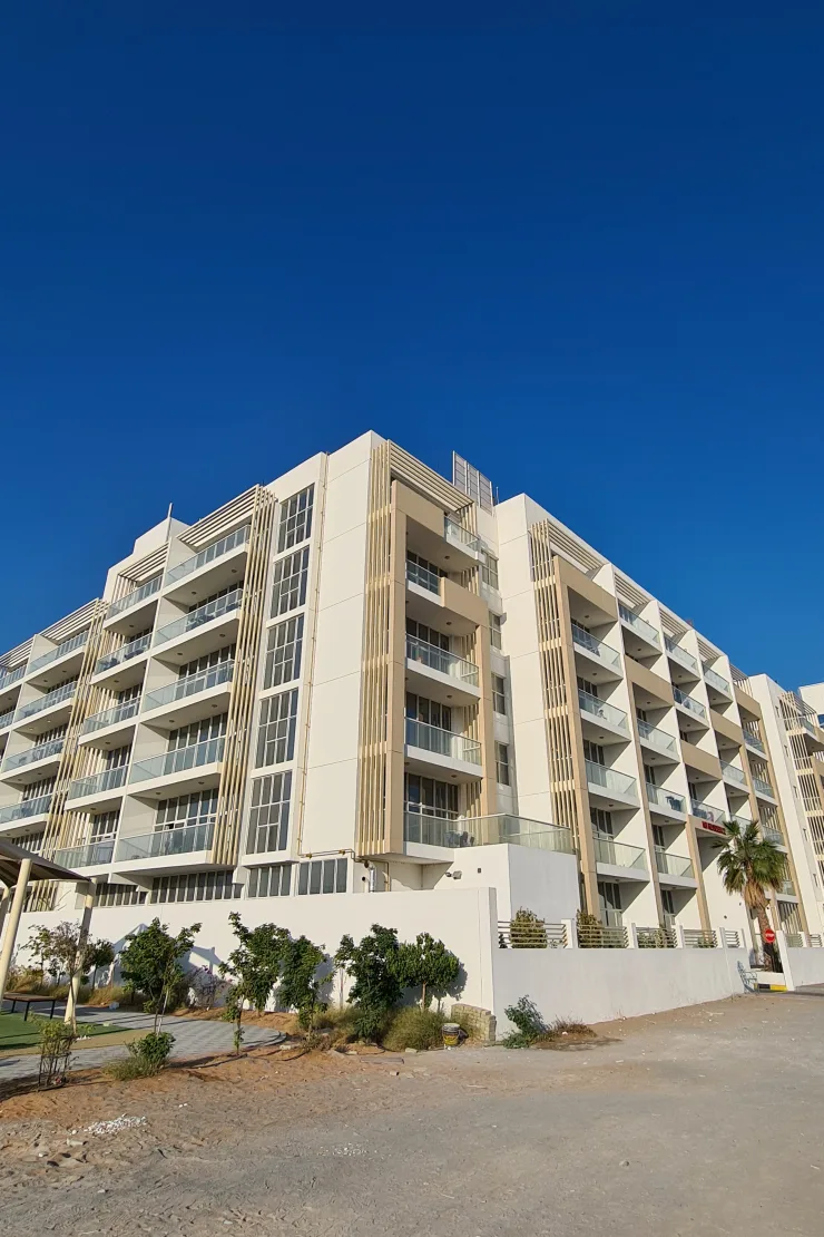 Corner of building with timber-look fins and balconies