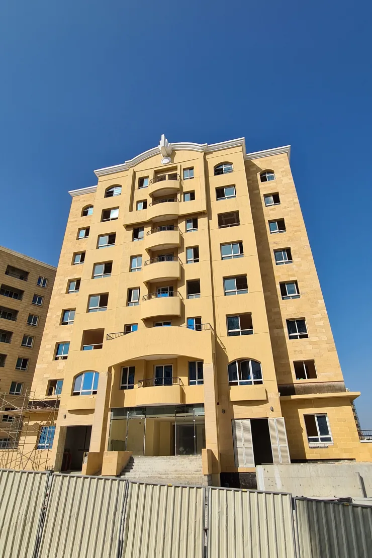 Same tower from the front, entrance and crown emblem