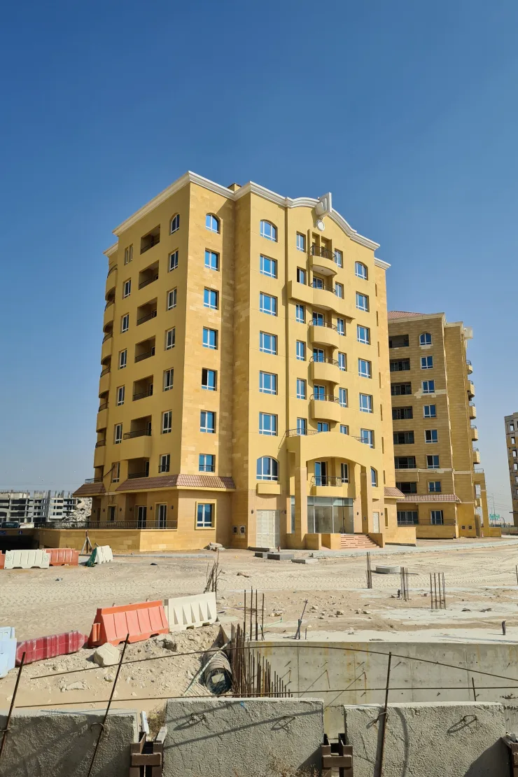 Same yellow tower seen from the street side
