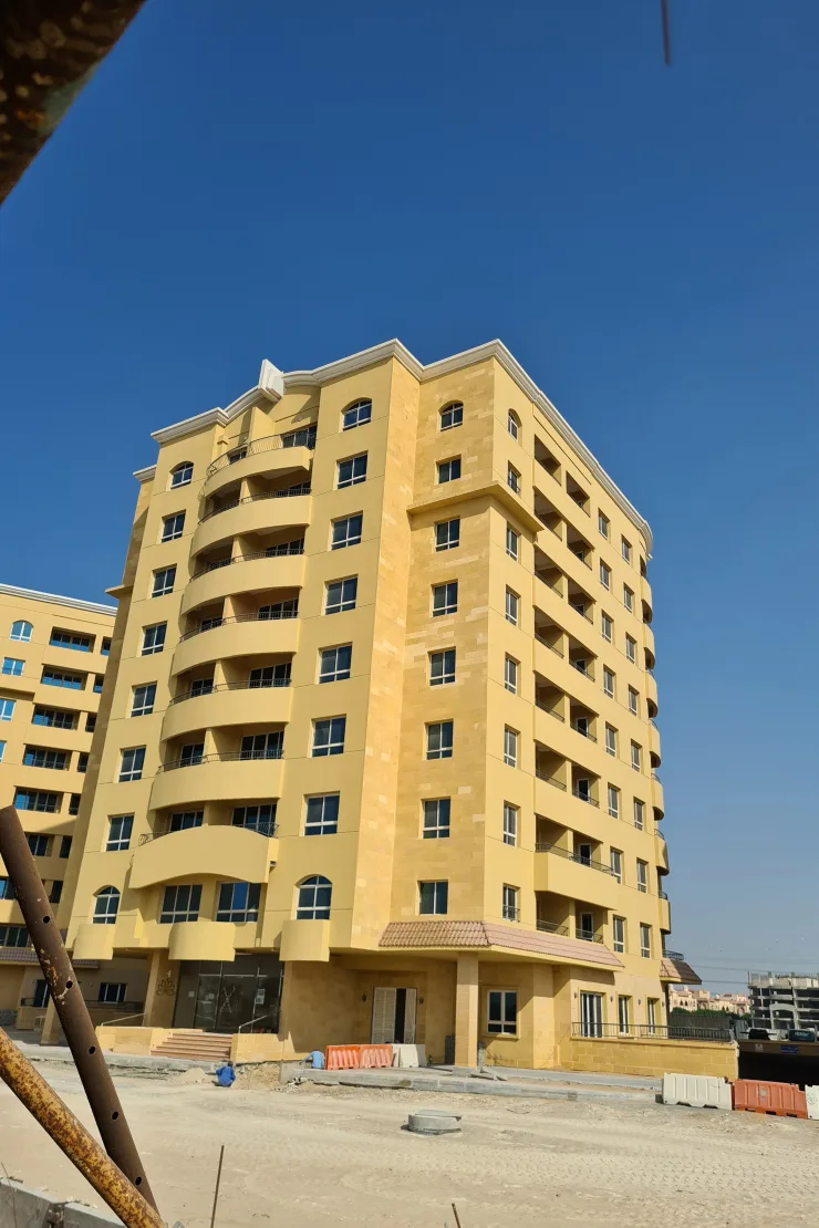 Corner view of the tower with curved balconies