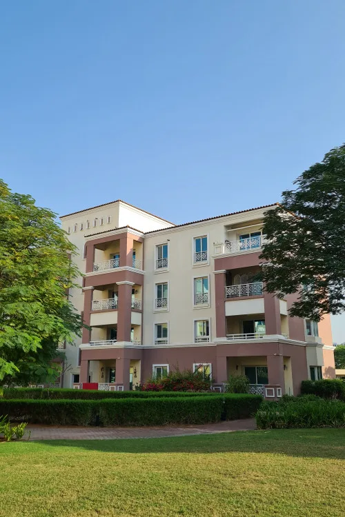 Four-storey block with balconies and pink columns