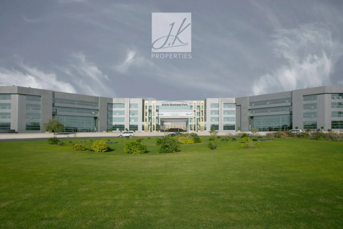 Full facade seen across the lawn