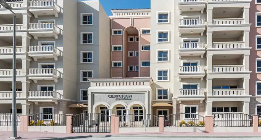 Entrance facade with Centurion Residence signage and balconies