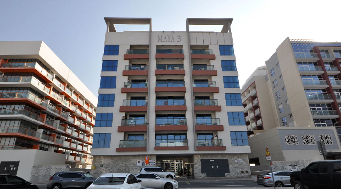 Front facade of the completed building with Maya 3 sign, 1408x781