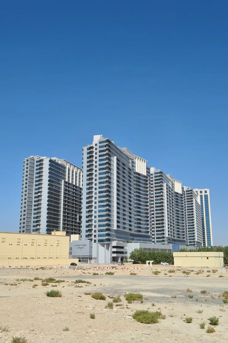 outside, full height; whole Skycourts Towers project (several of the six towers), not Tower E alone (740x1110 portrait)