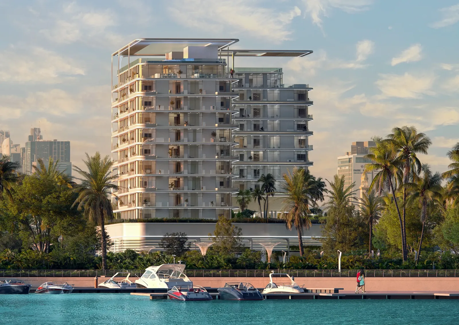 Waterfront view of stepped towers and rooftop canopies