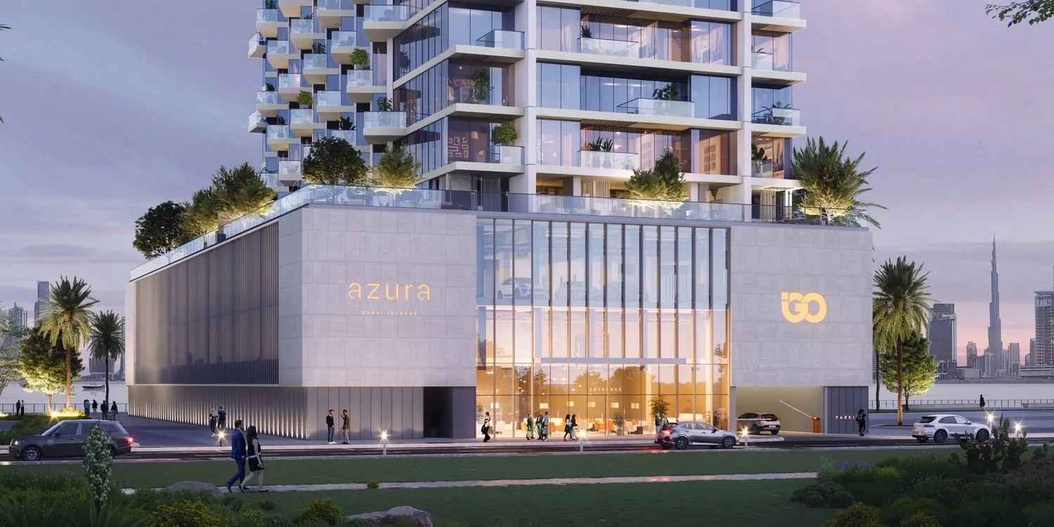 Podium entrance with azura and IGO signage at dusk