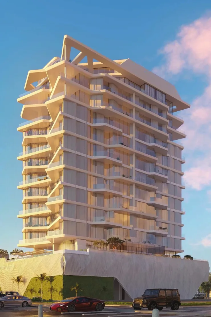 Cream tower, sculpted balconies, angular crown