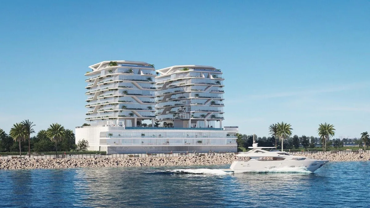 Two terraced towers on white podium, seafront