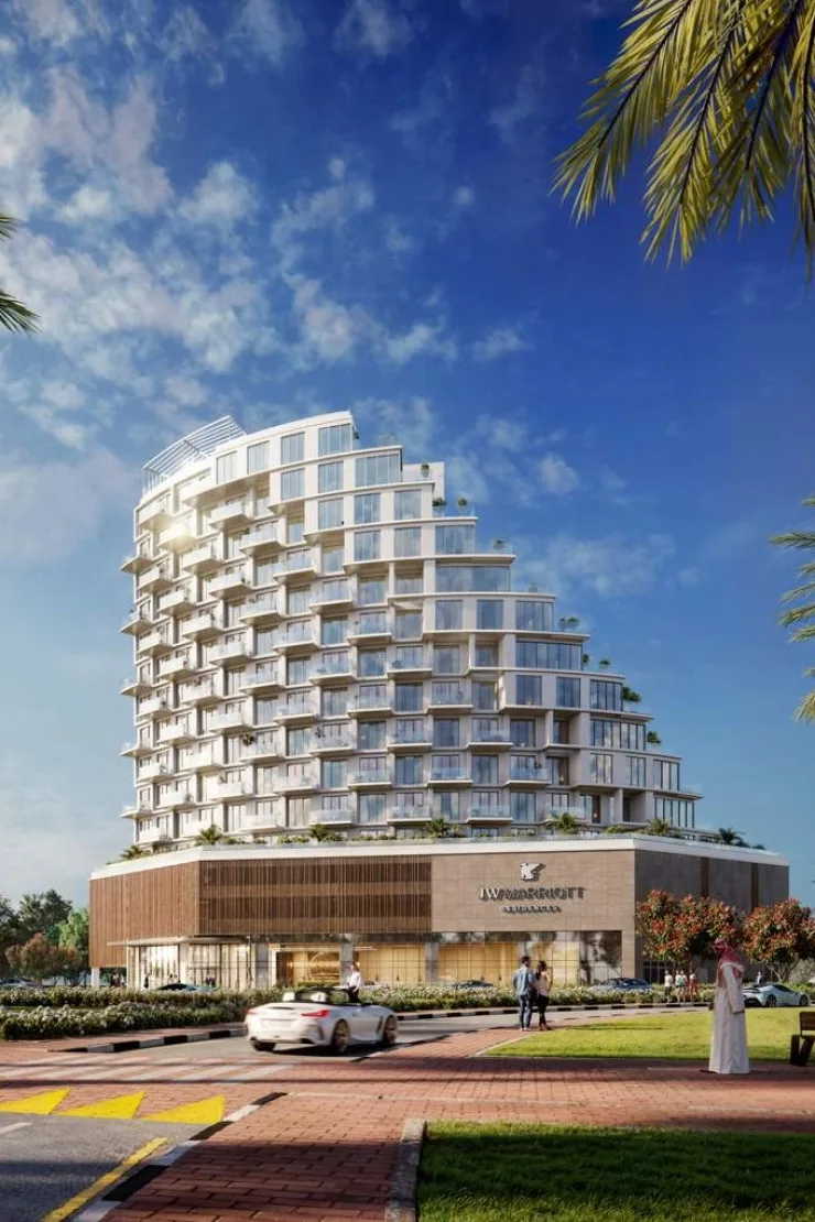 Stepped tower above timber-clad podium with JW Marriott sign