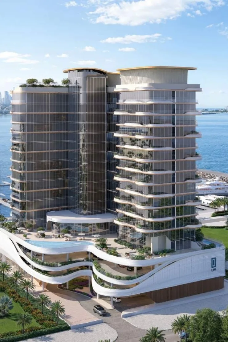 Tower with podium pool deck, LIV sign, sea behind