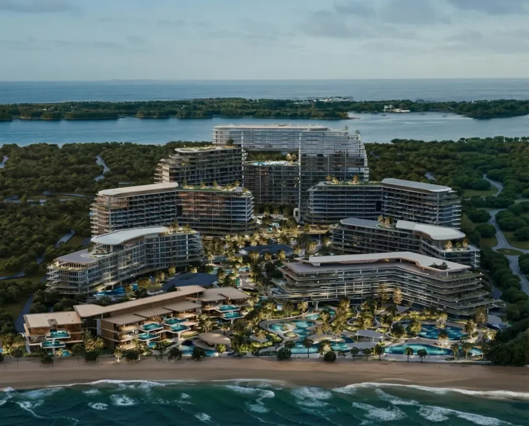 Beachfront aerial render showing terraced blocks and pools
