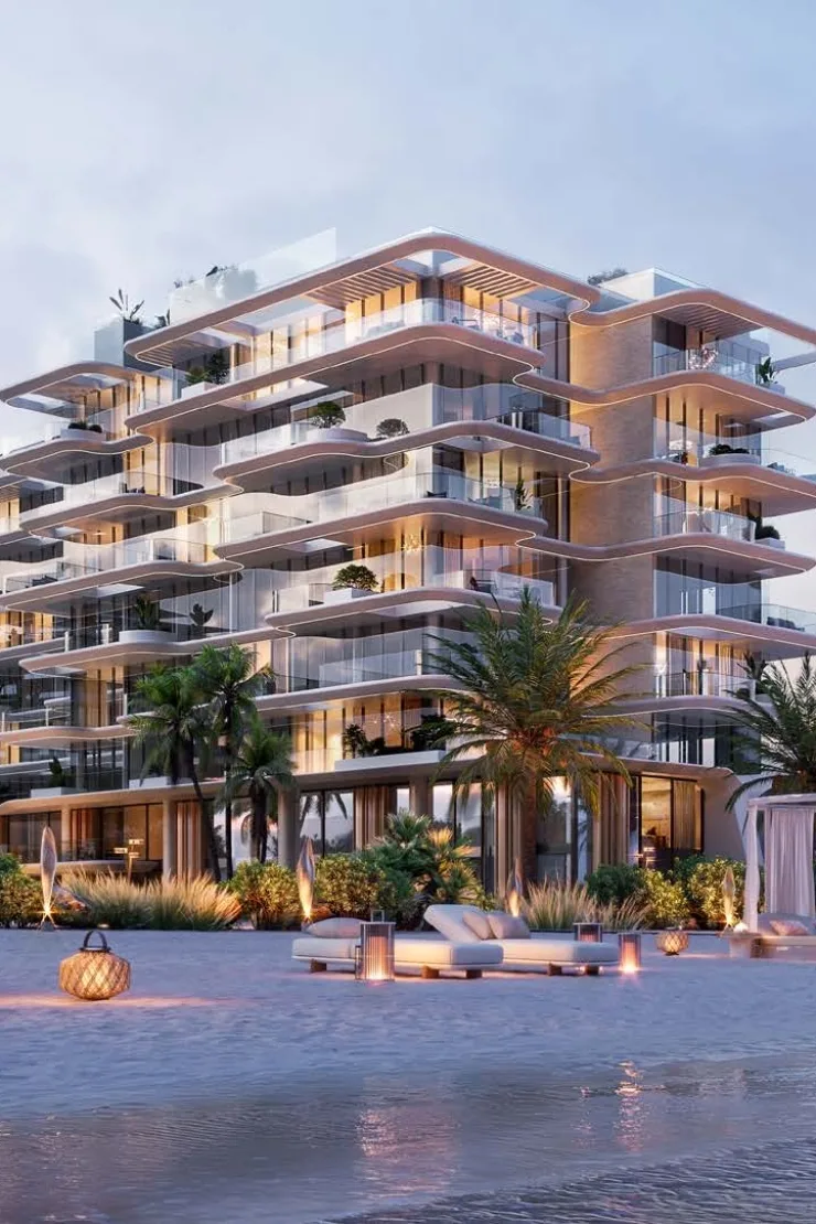 Dusk view of curved balconies and beach lounge