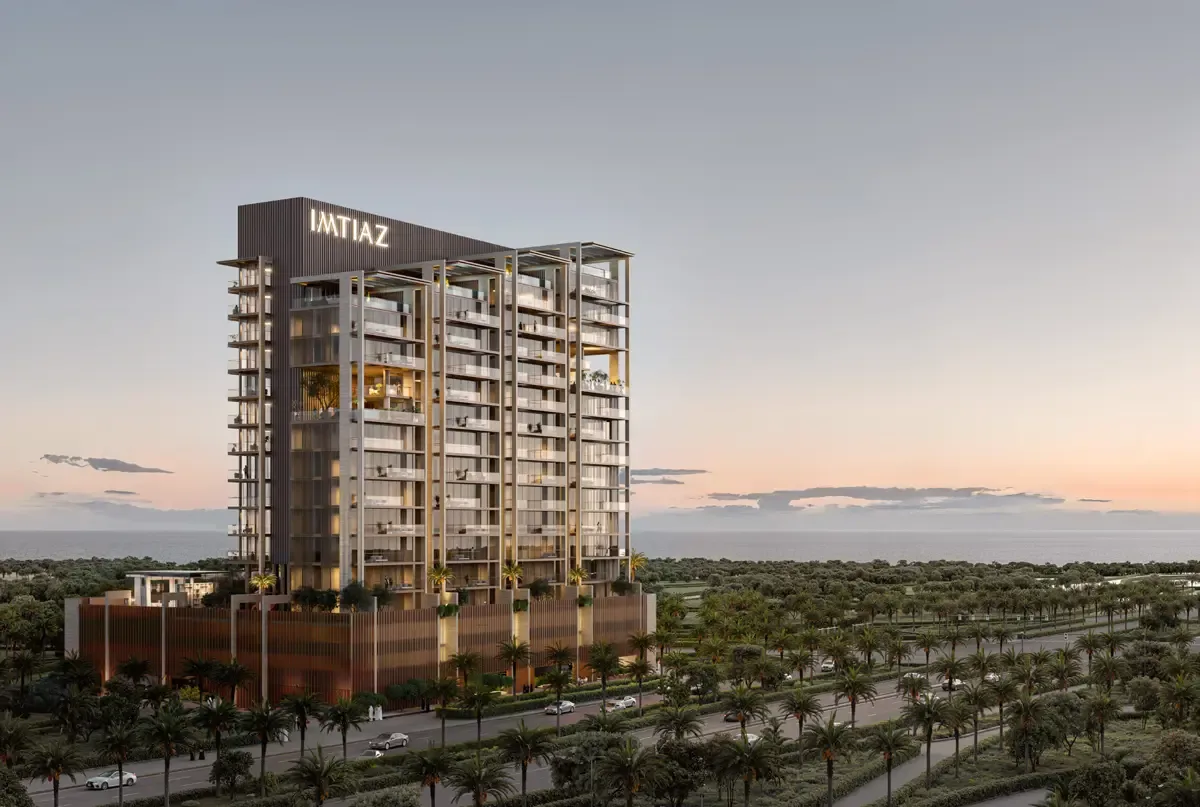 Full tower with IMTIAZ crown and timber podium at dusk