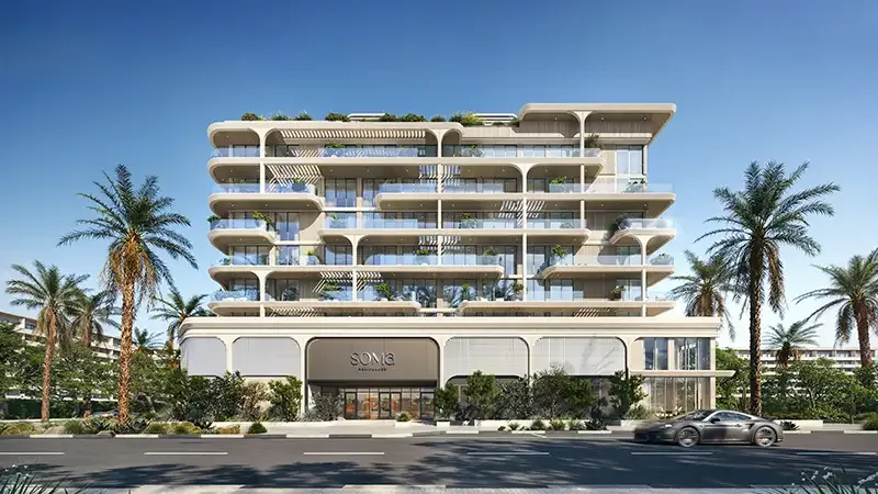 Front elevation of Soma Residences with signage, arched balconies