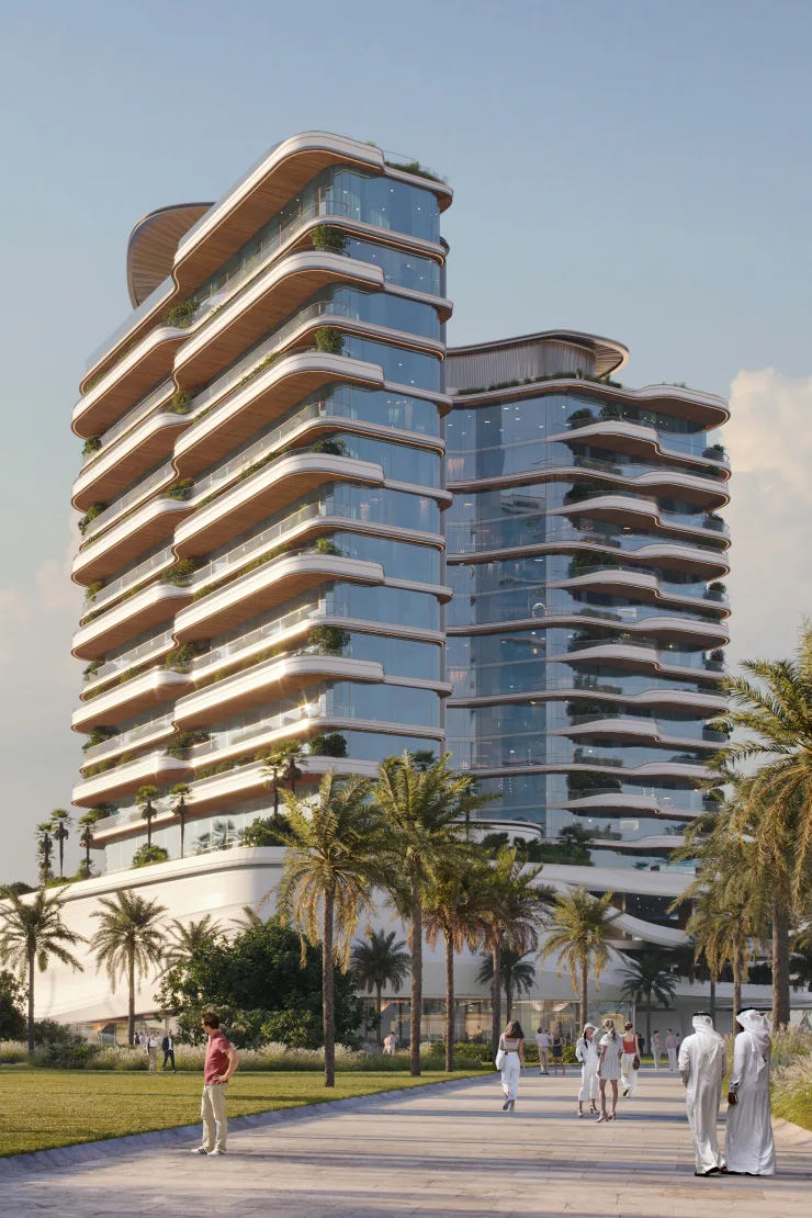 Twin curved-balcony towers seen from the waterfront promenade