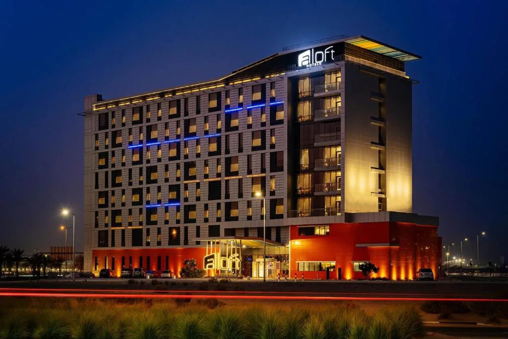 Aloft Dubai South at dusk, full facade