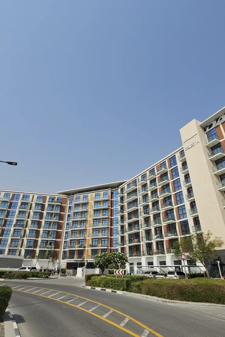 Celestia Tower B curved facade, signage, from the road