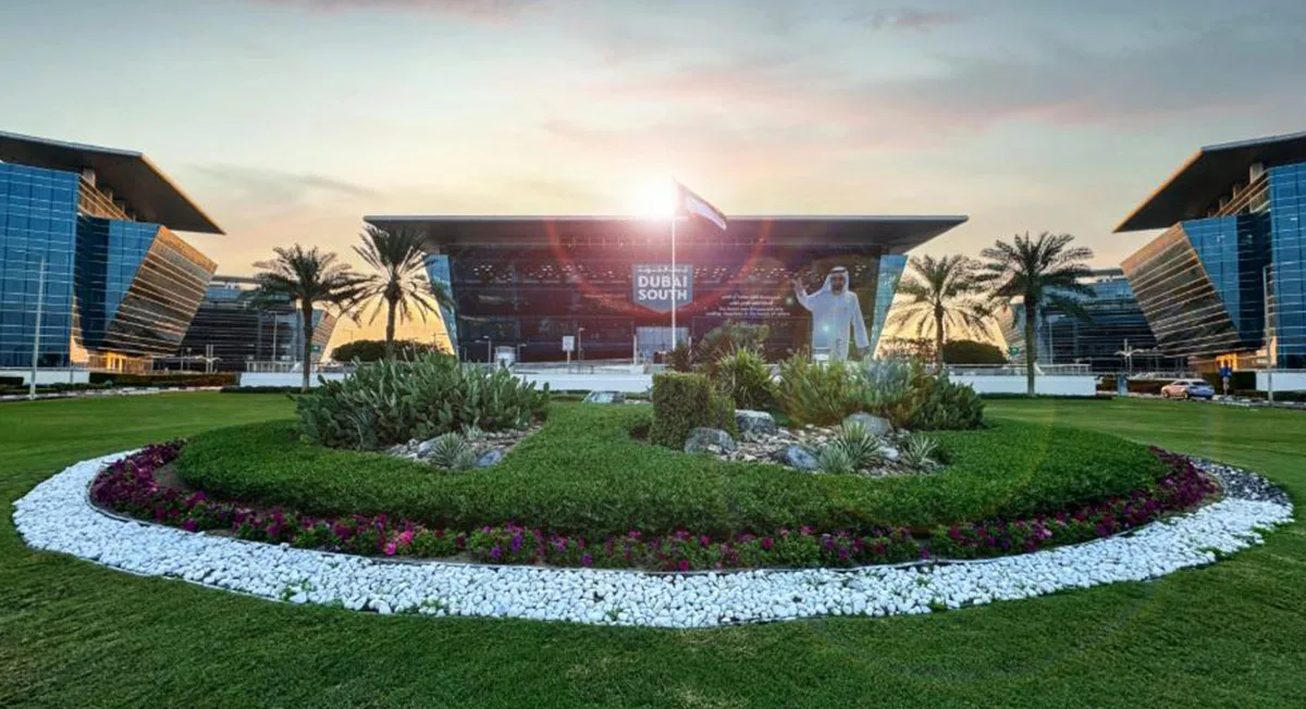 HQ entrance at sunset, flanked by glass wings