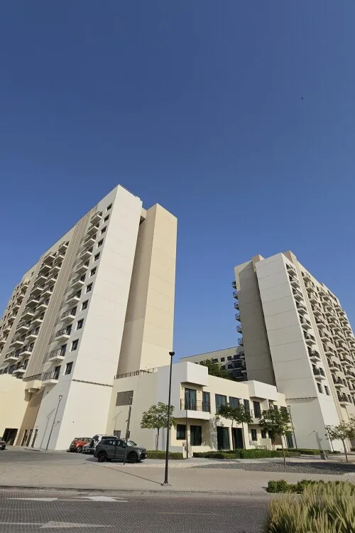 Completed cream apartment blocks with balconies in Emaar South