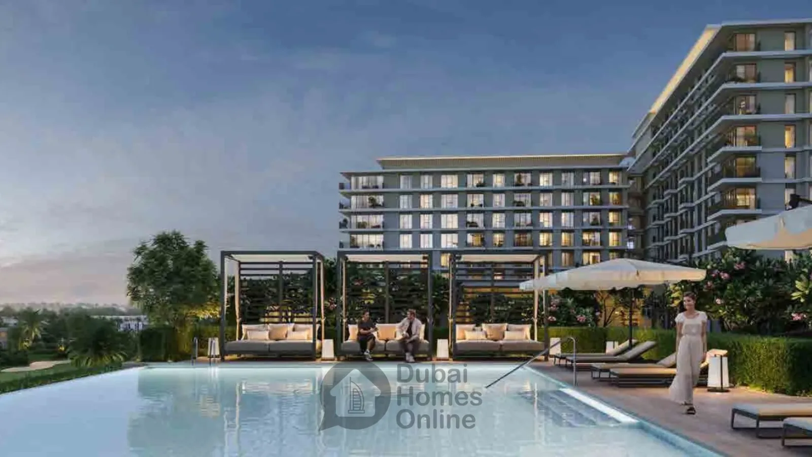 Pool with cabanas and apartment block at dusk