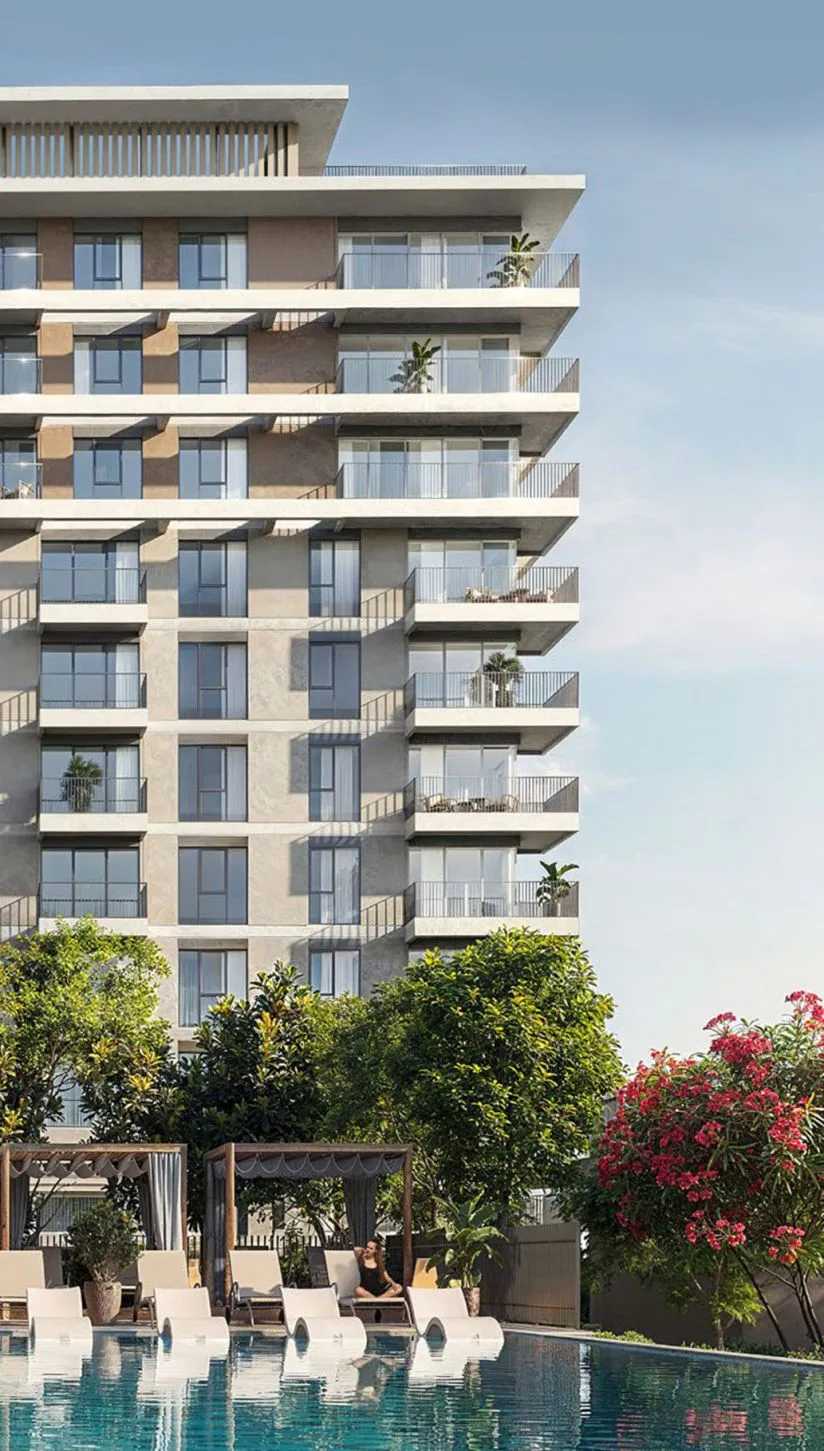 Upper floors with balconies above pool cabanas