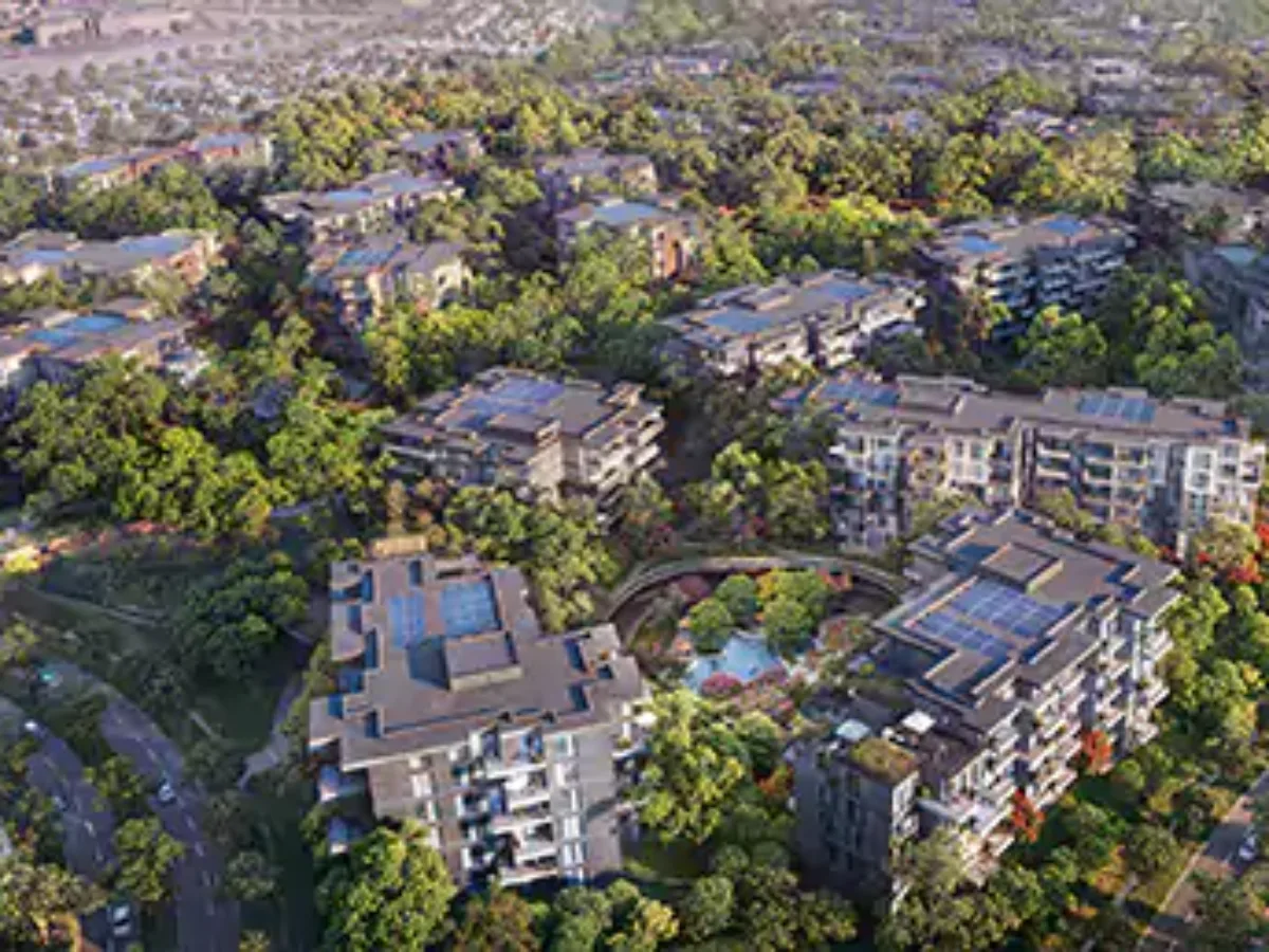Aerial render of low-rise blocks around landscaped pool